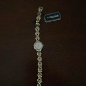 Dainty Pulsar bracelet style wristwatch.